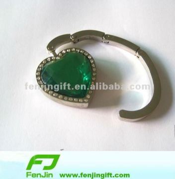 Folded heart shape bag hanger