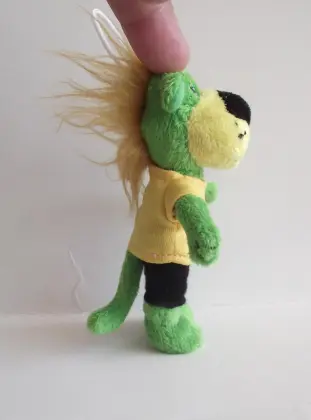 Green bear key chain wearing clothes