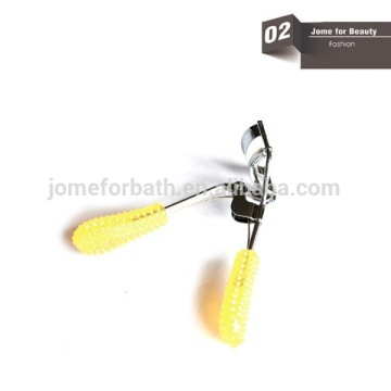 yellow eyelash curler for beauty and material is iron