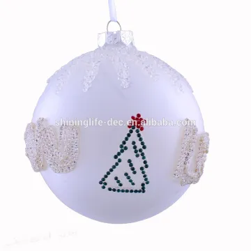 Shiny glass Christmas balls with snow