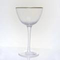 ribbed champagne flute glass with gold rim