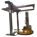 Pallet wrapping machine with Top sheet dispenser