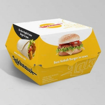 Hamburger and fresh vegetables composition in paper box