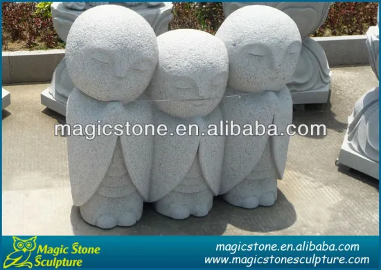 3 stone statues of buddha