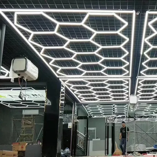 Gold Hexagonal Chandelier LED Pendant with Puck Shelves and Roof Lighting Showroom