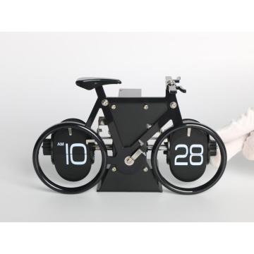 Reloj de flip para voltear en bicicleta sobre la mesa