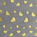 Tessuto a rete in tulle di poliestere con stampa laminata di cuori dorati