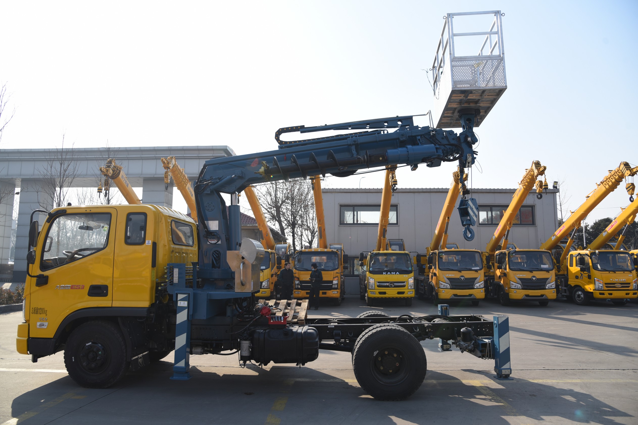 Multi-functional truck-mounted crane with drill bit