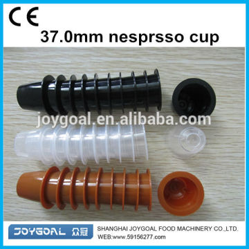 tazas vacías que se ajustan a la máquina de llenado de la cápsula de café de Nespresso