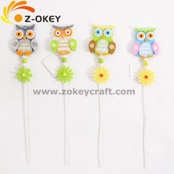 Different owl felt crafts with a stick for home decoration