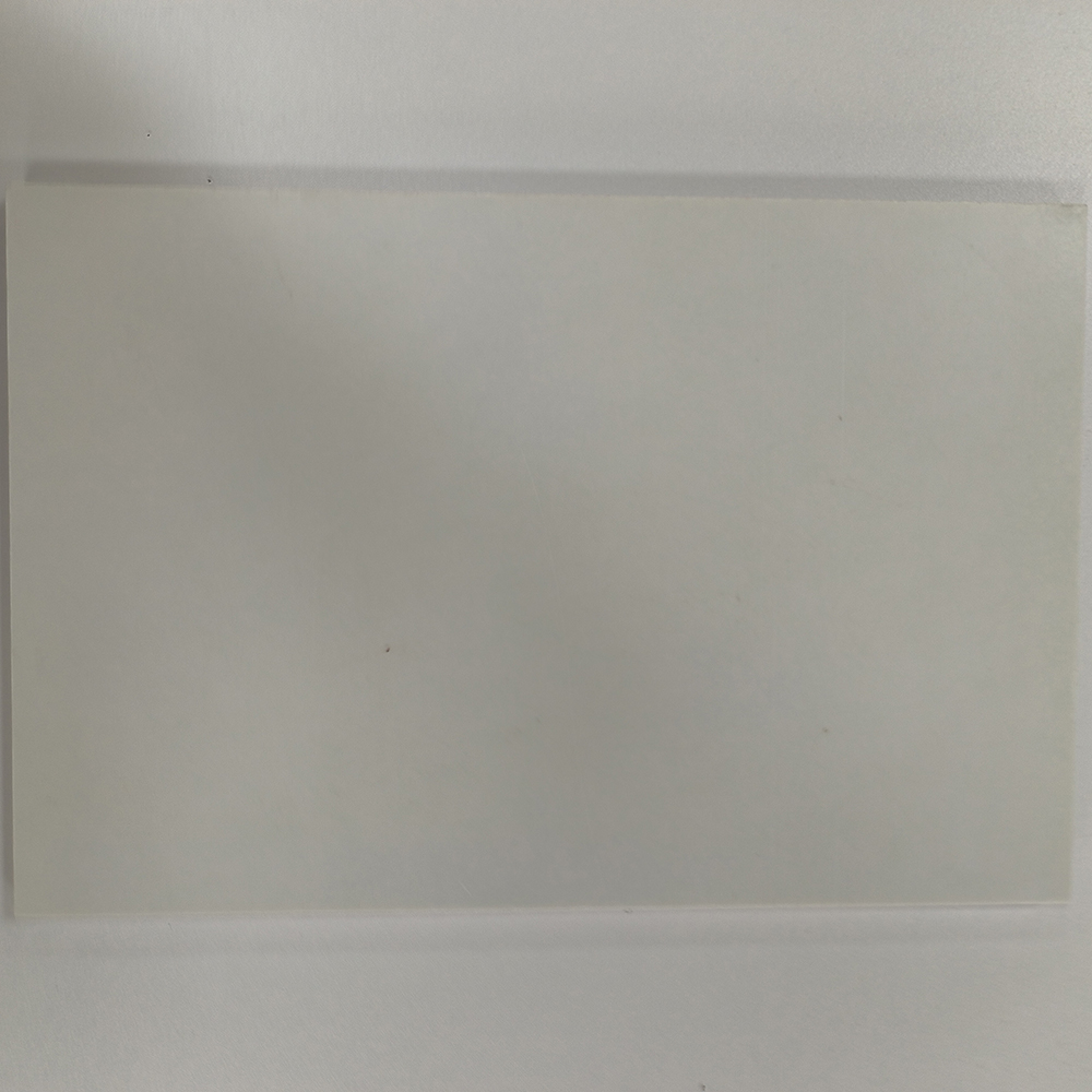 White GPO-3 polyester glass mat insulation sheet, smooth surface, top view on white background
