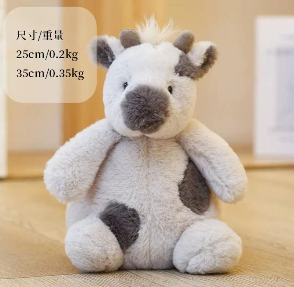 Black and white cow plush toy