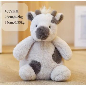 Black and white cow plush toy