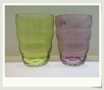 man-blowing colorful decorative tumbler