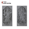 Um par de estátuas de deus da porta esculpida de tijolos