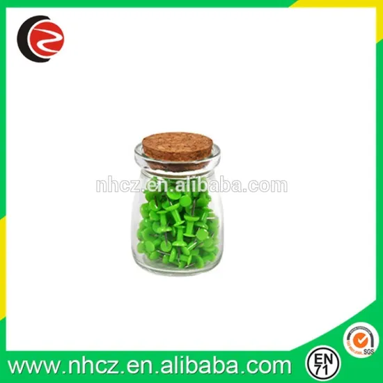 Green Flat push pin in glass bottle