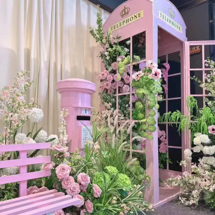 Decorative Props for Outdoor Wedding Parties: Incorporating a Pink London Telephone Booth