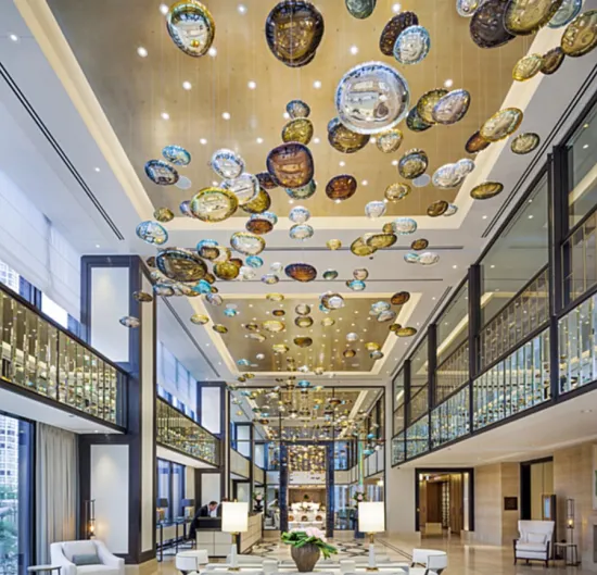 Amber chandelier in the center of hotel lobby