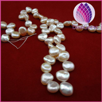 Pearl,baroque, freshwater ,peach, 7-8mm top-drilled flat-sided round, B grade. Sold per pkg of (10)15-inch strands.