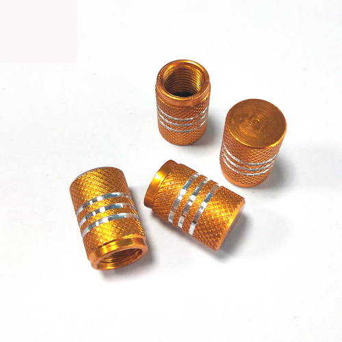 Tire valve stem caps with chrome stripes