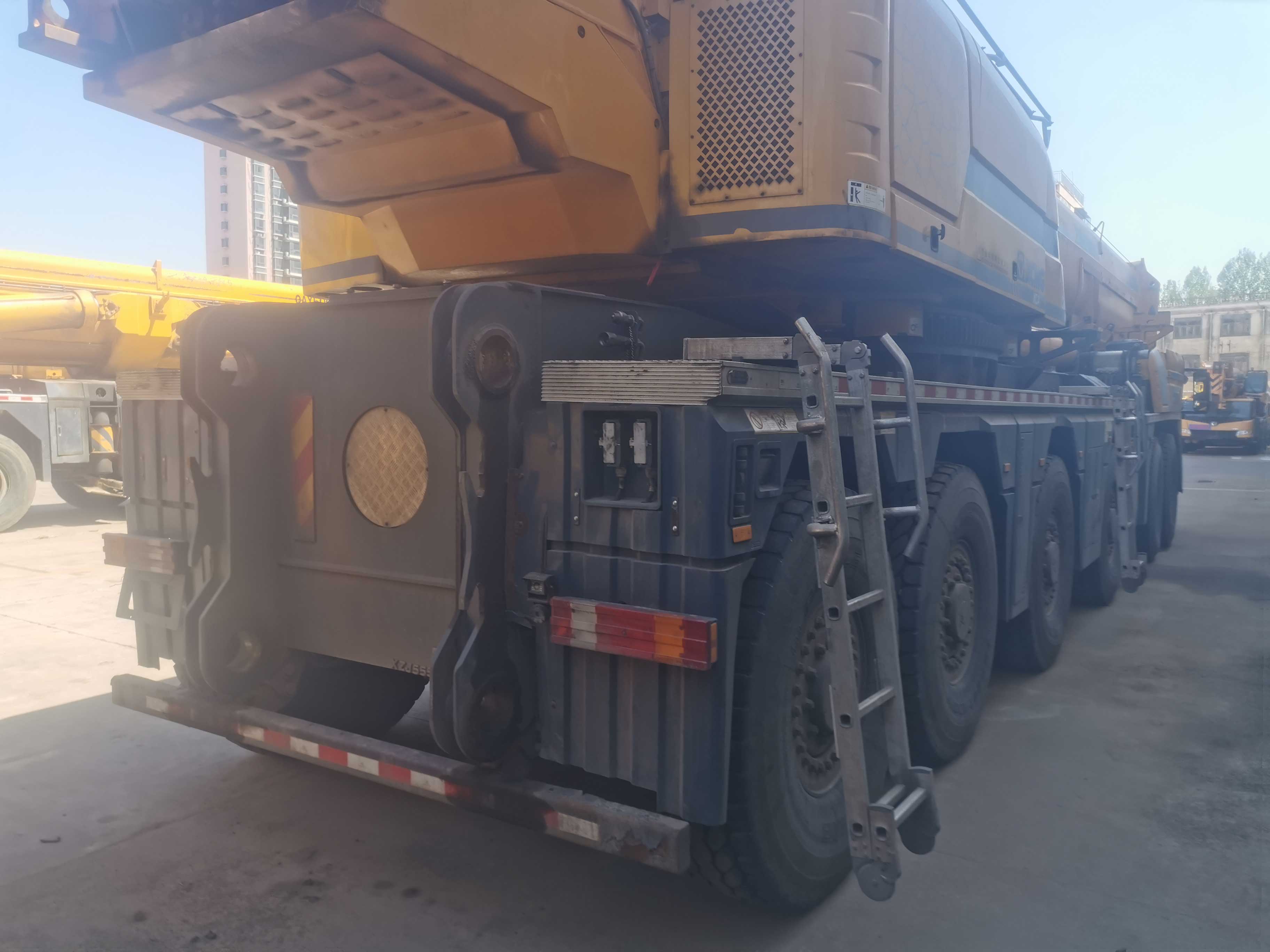 Low-angle-shot-of-used-mobile-crane-against-sunset-sky-XCA460