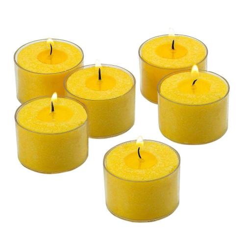 Luce gialla nelle candele di citronella scura