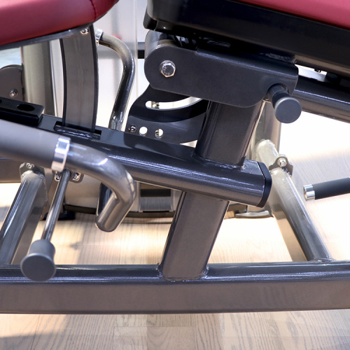 Dual function leg extension/prone leg curl machine