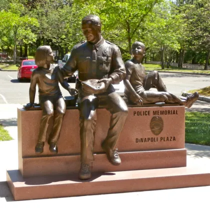 Outdoor garden life size bronze police man and police dog statue