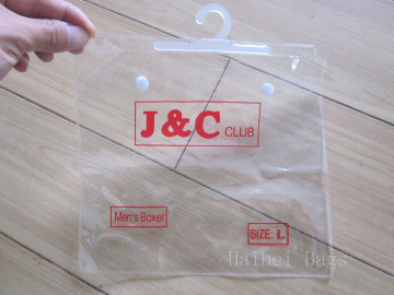 PVC Clothing Packaging Bag, PVC Garment Packing Bag with a Hook and Button (hbpv-66)