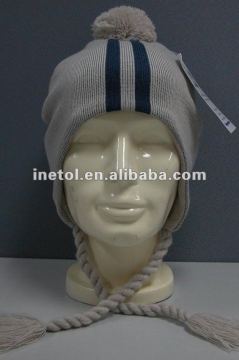 grey color knitted winter warmer hat with ear muff