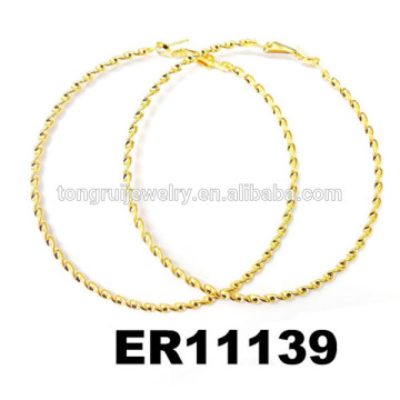 women large metal twisted gold hoop earrings