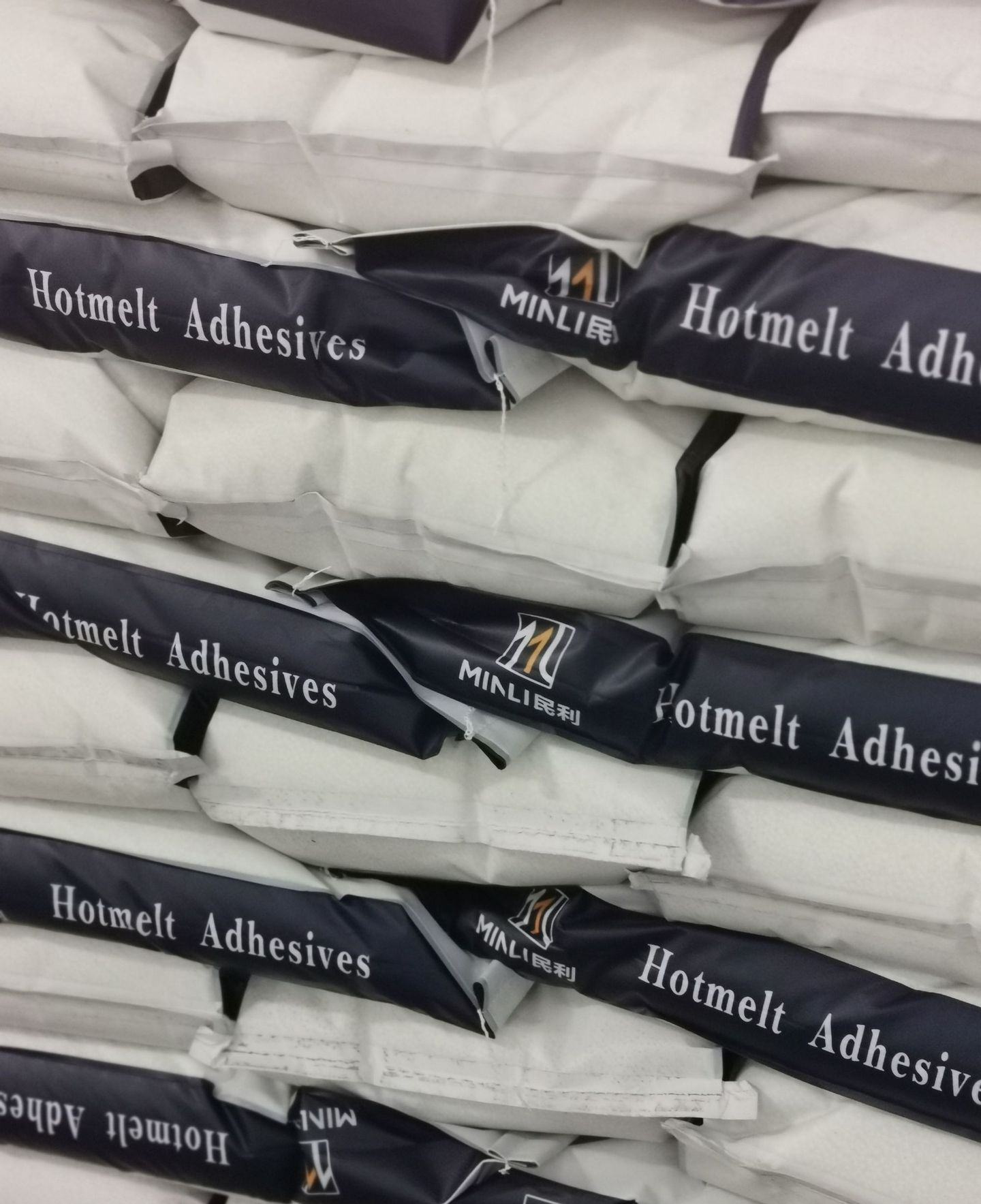 Medium temperature black hot melt adhesive
