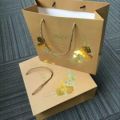 Gouden folie boodschappentassen witte kraft kleur papier