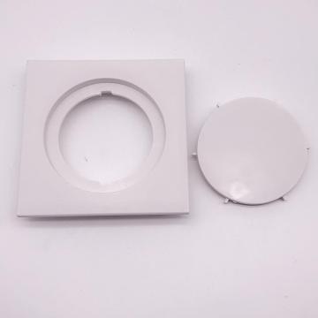 White plastic square bathroom fitting floor drain