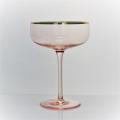 pink colored wine glass set with gold rim