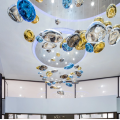 Large shaped glass chandelier in the hotel lobby