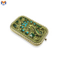 Mini square pocket mirror with peacock logo