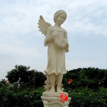 Guardian angel statue with flowers