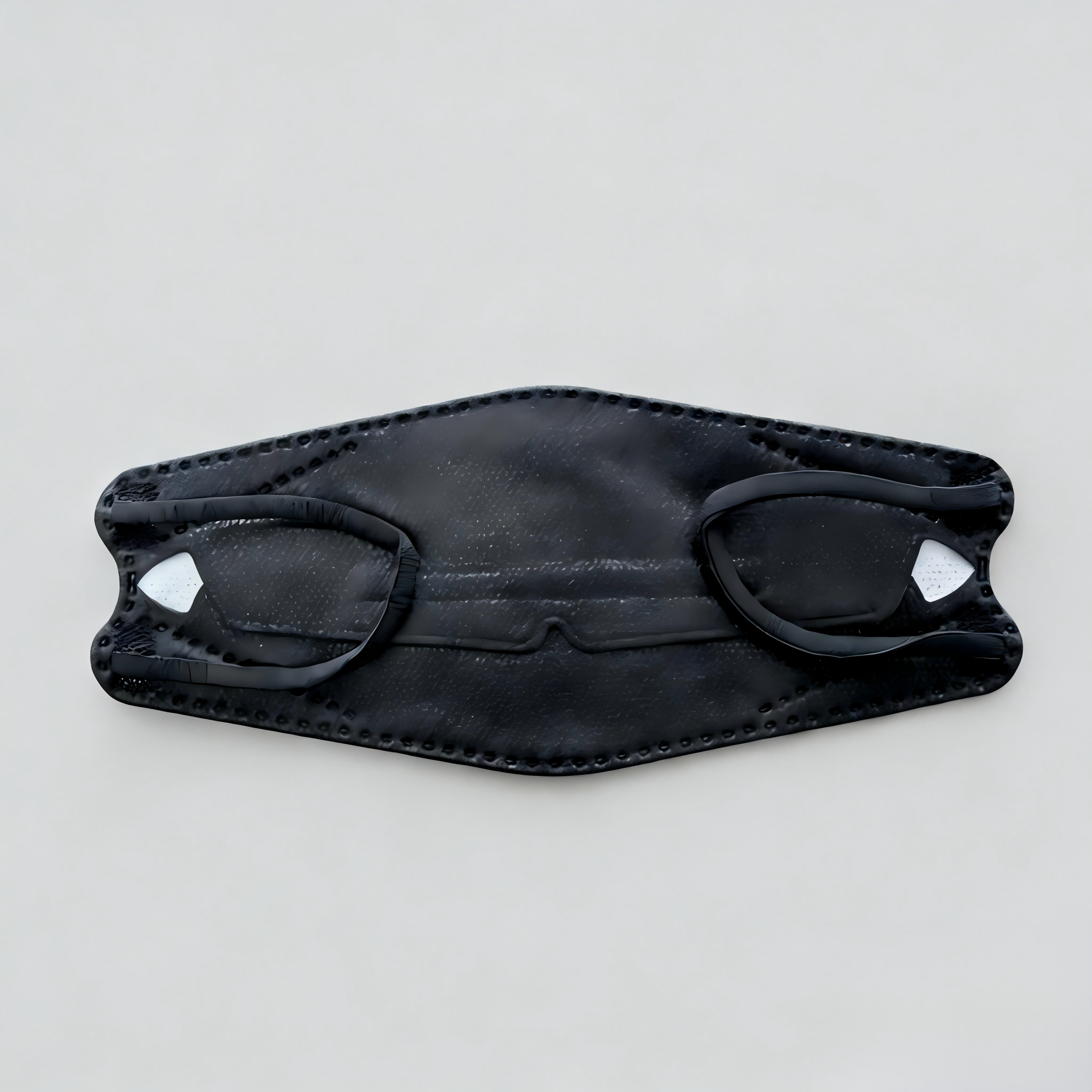 black fish-shaped mask