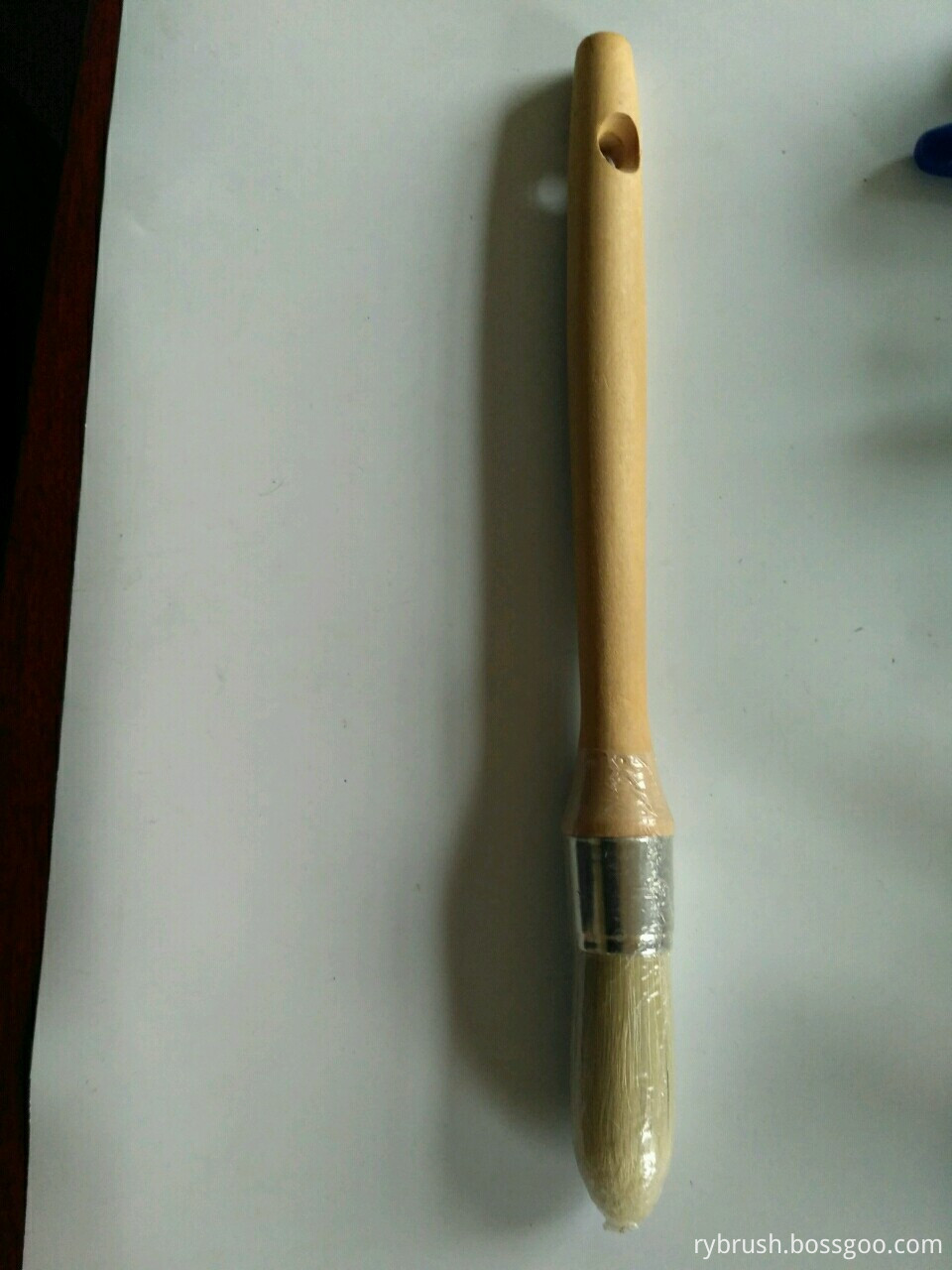 round brush with wooden handle