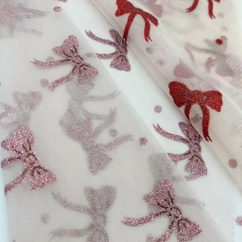 Maglia in tulle di poliestere glitterato con punti di fiocco