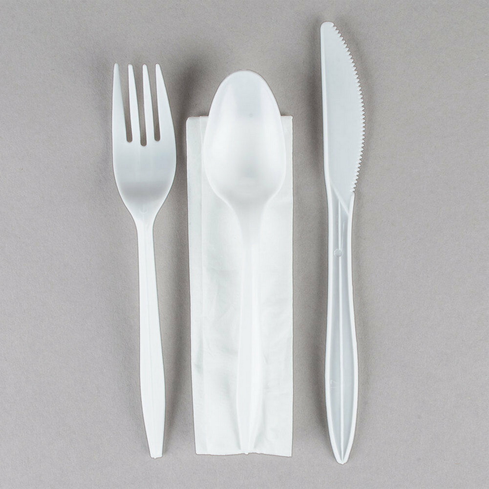 plastic utensils wrapped in napkins 