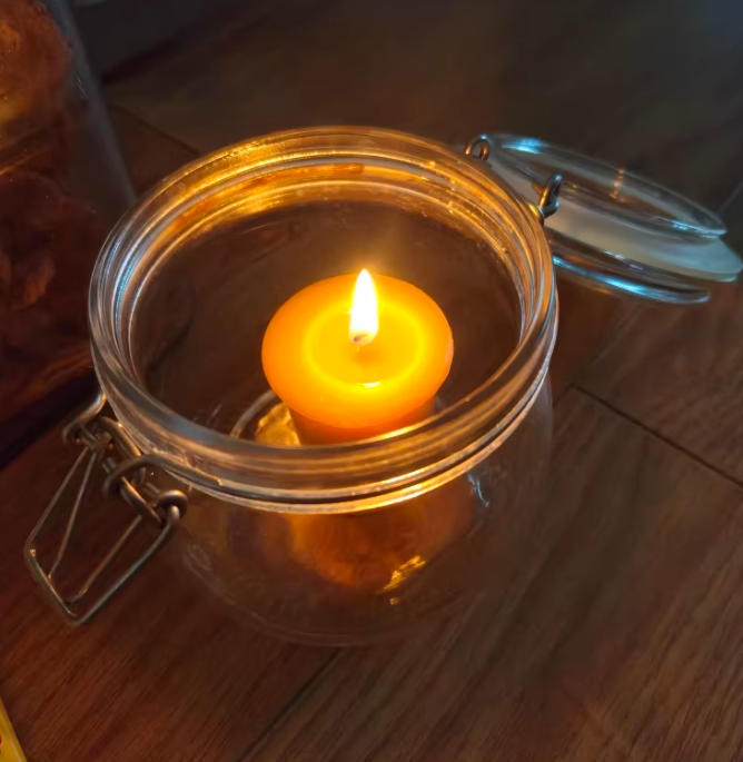 votive candle in a jar