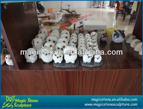 white stone owl carving