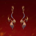 Les boucles d'oreilles "Dancing Fire" sont appliquées