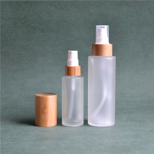 Botellas de la bomba de vidrio esmerilado con tapa cosmética de bambú