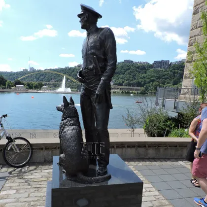 Outdoor garden life size bronze police man and police dog statue