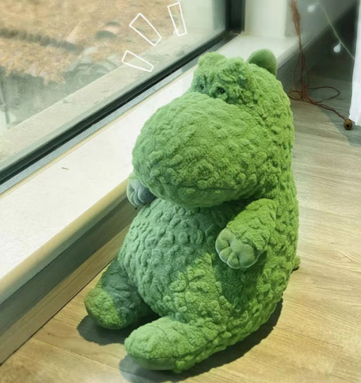 Petit jouet en peluche en peluche de dinosaure vert