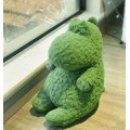 Small green dinosaur stuffed plush toy