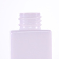 Opal white square bottle with golden dropper cap